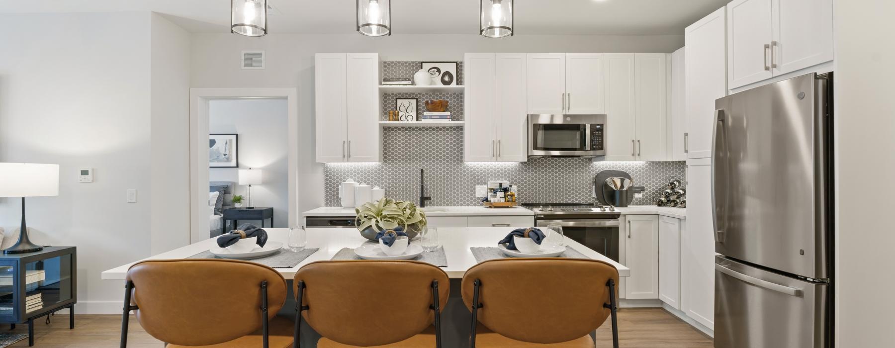 a kitchen with a table and chairs