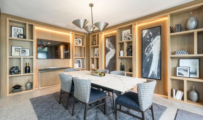 Enjoy our resident-only features a dining room with a table and chairs