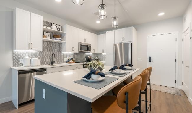 Spacious kitchens with thoughtful details a kitchen with white cabinets