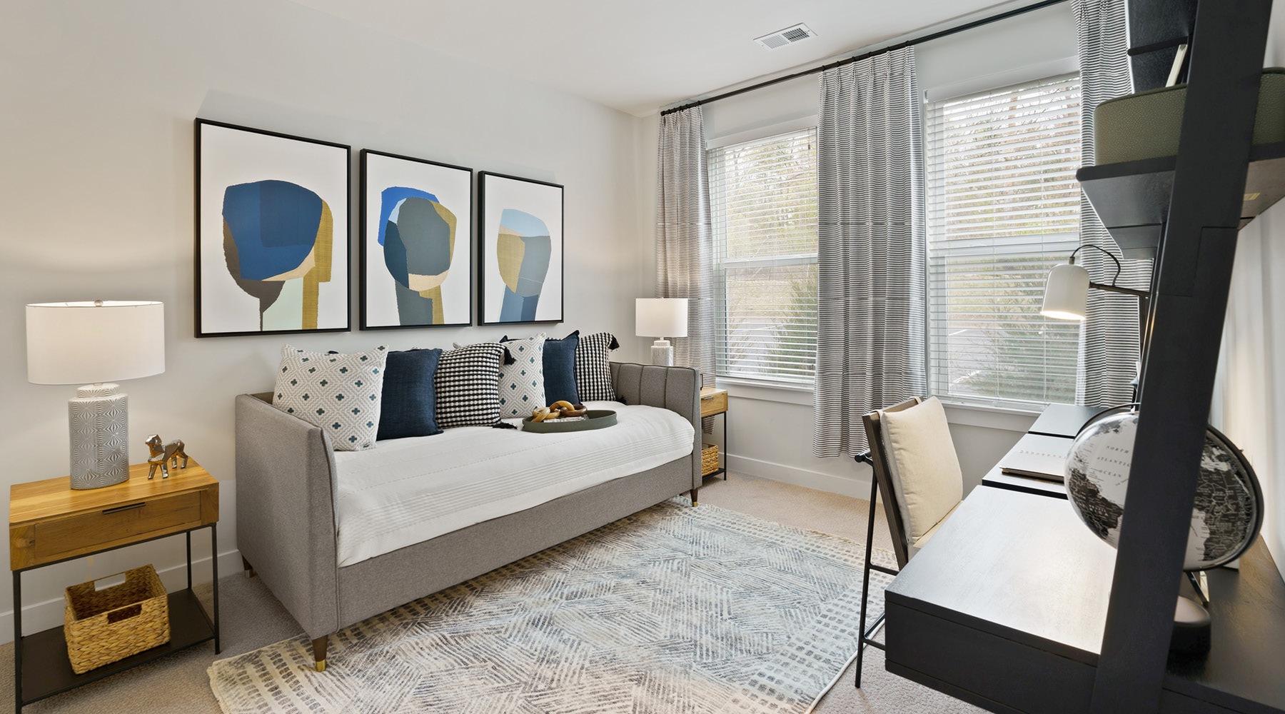 Come Home to Elegance	 Bedroom with a bed and office desk inside an apartment home at Hathon