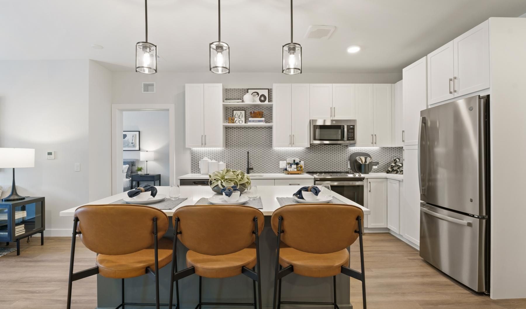 a kitchen with a table and chairs